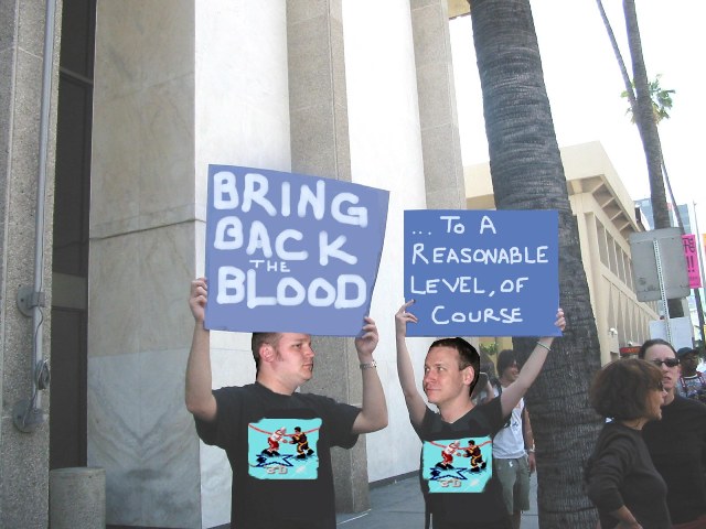 Nate (right) protests outside of EA's HQ with his Brother posing as Nick to bring back the blood in NHL 95. 